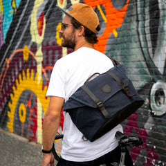 Alaskan Maker Messenger Bag in Charcoal on cyclists back