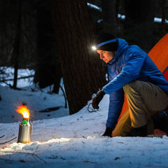 Kelly Kettle Trekker Stainless Steel 0.6L being used by a man camping in the snow