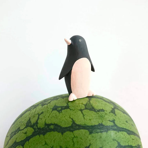 T-Lab Pole Pole Penguin on a watermelon.